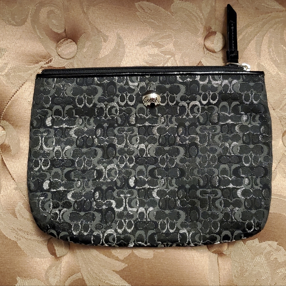 Coach signature collection evening bag clutch.